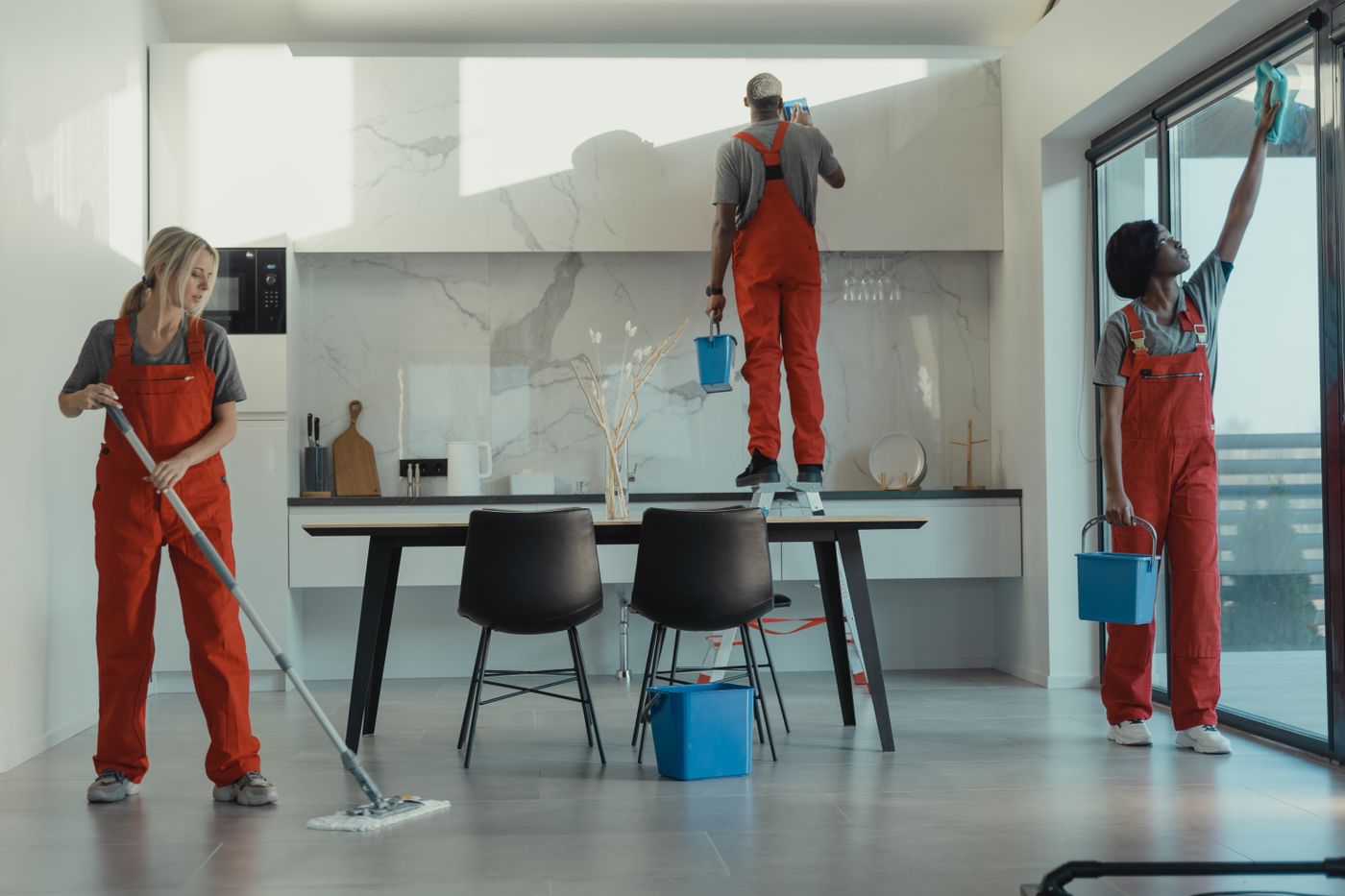 A uniformed cleaning team at work in a commercial space