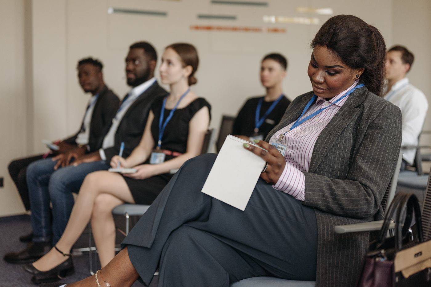 Staff taking notes during a training session